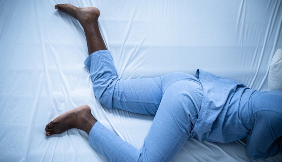 Woman sleeping, restless legs syndrome